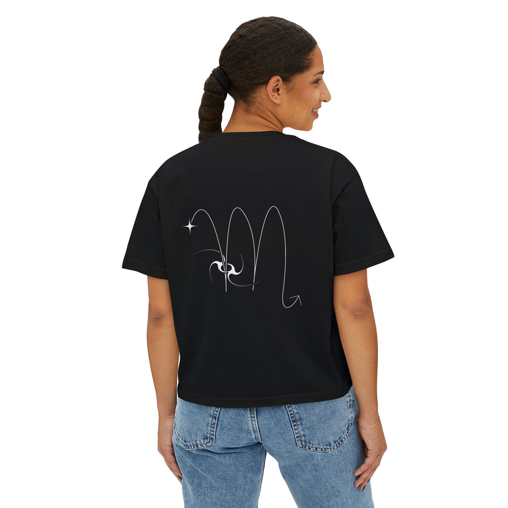 Person wearing a Black t-shirt with a minimalist Scorpio zodiac design in orbital line-art in the back