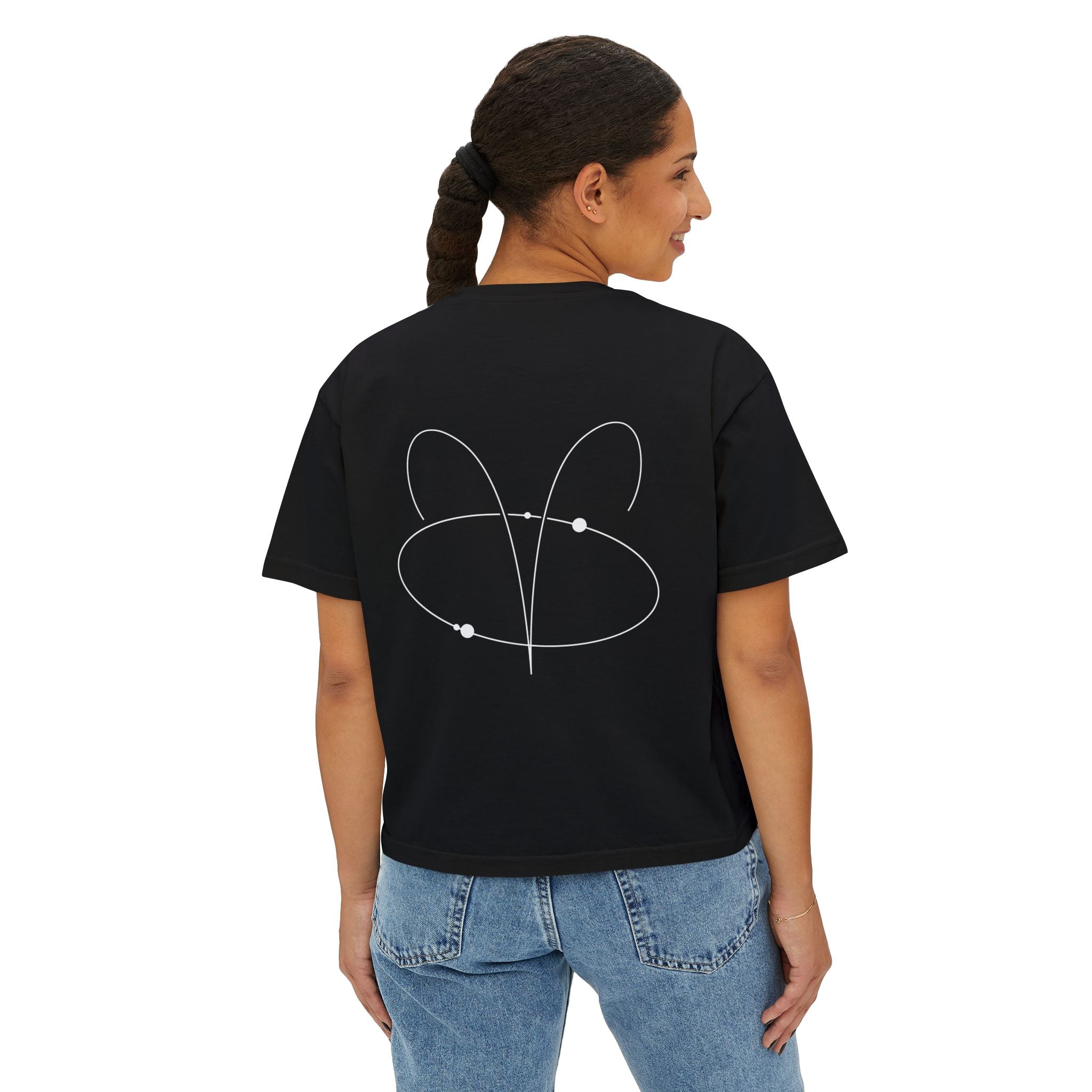 Person wearing a Black t-shirt with a minimalist Aries zodiac design in orbital line-art in the back