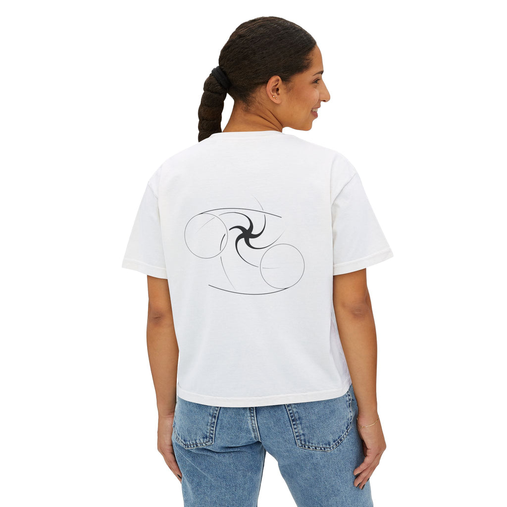 Person wearing a white t-shirt with a minimalist Cancer zodiac design in orbital line-art in the back