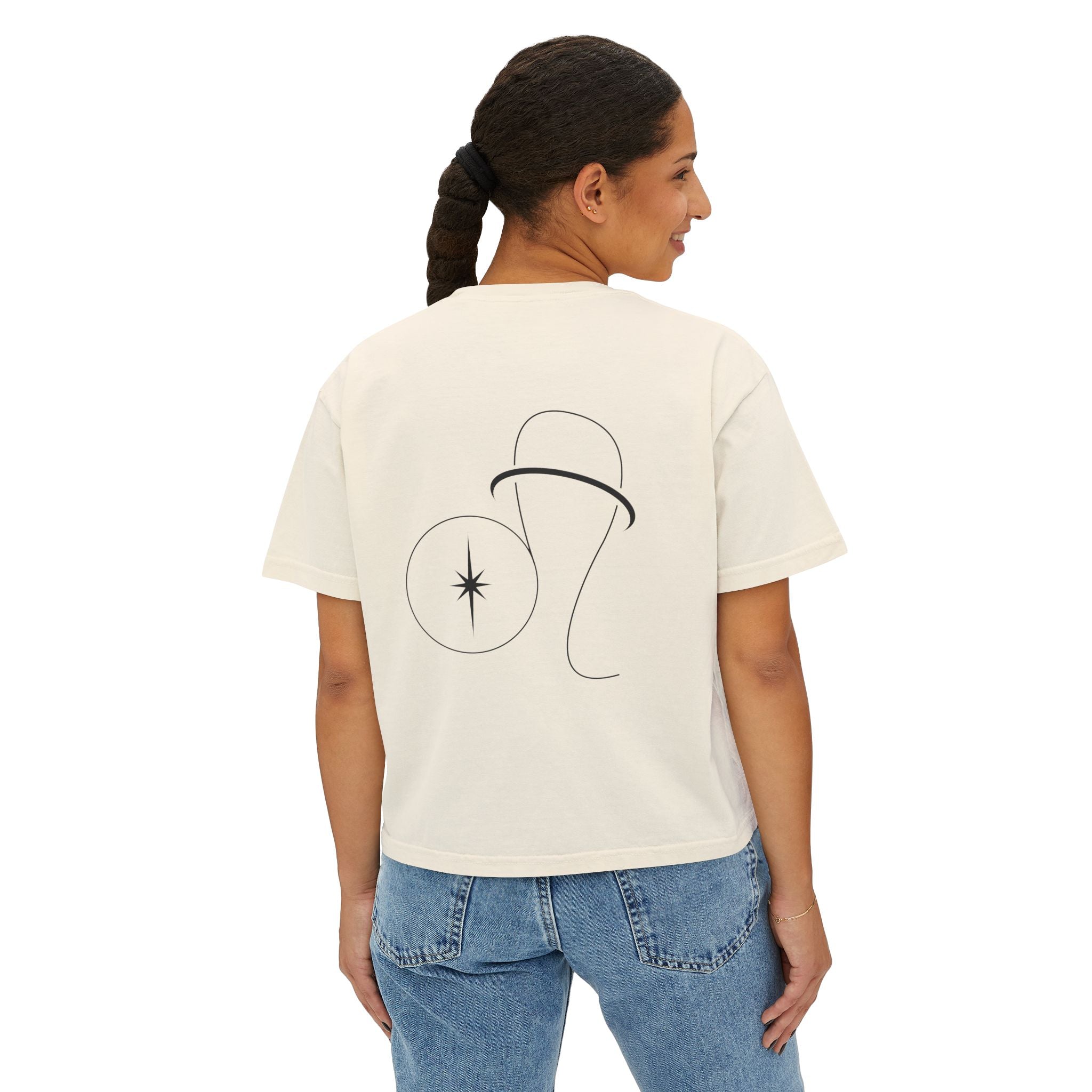 Person wearing a Beige t-shirt with a minimalist Aries zodiac design in orbital line-art in the back
