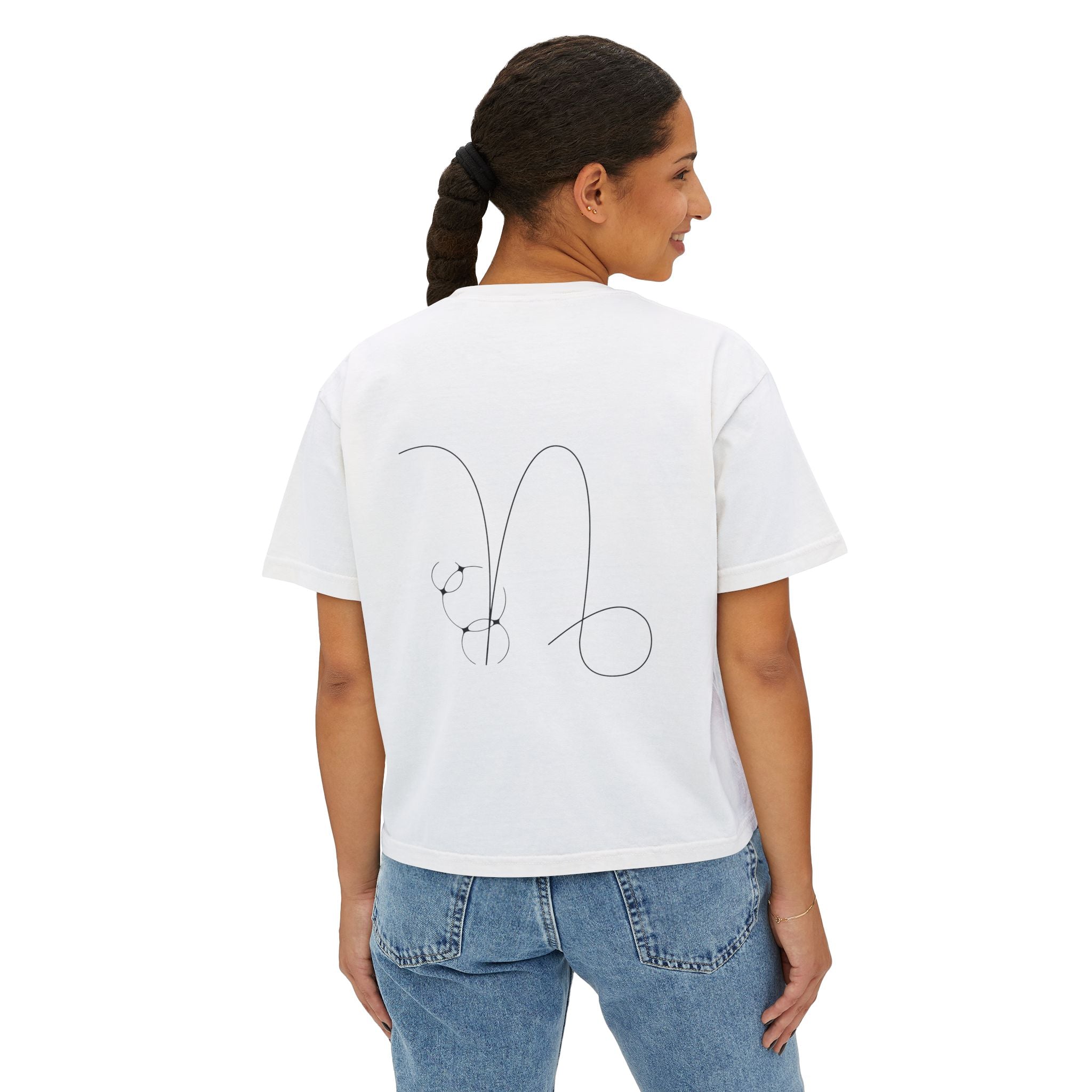 Person wearing a white t-shirt with a minimalist Capricorn zodiac design in orbital line-art in the back