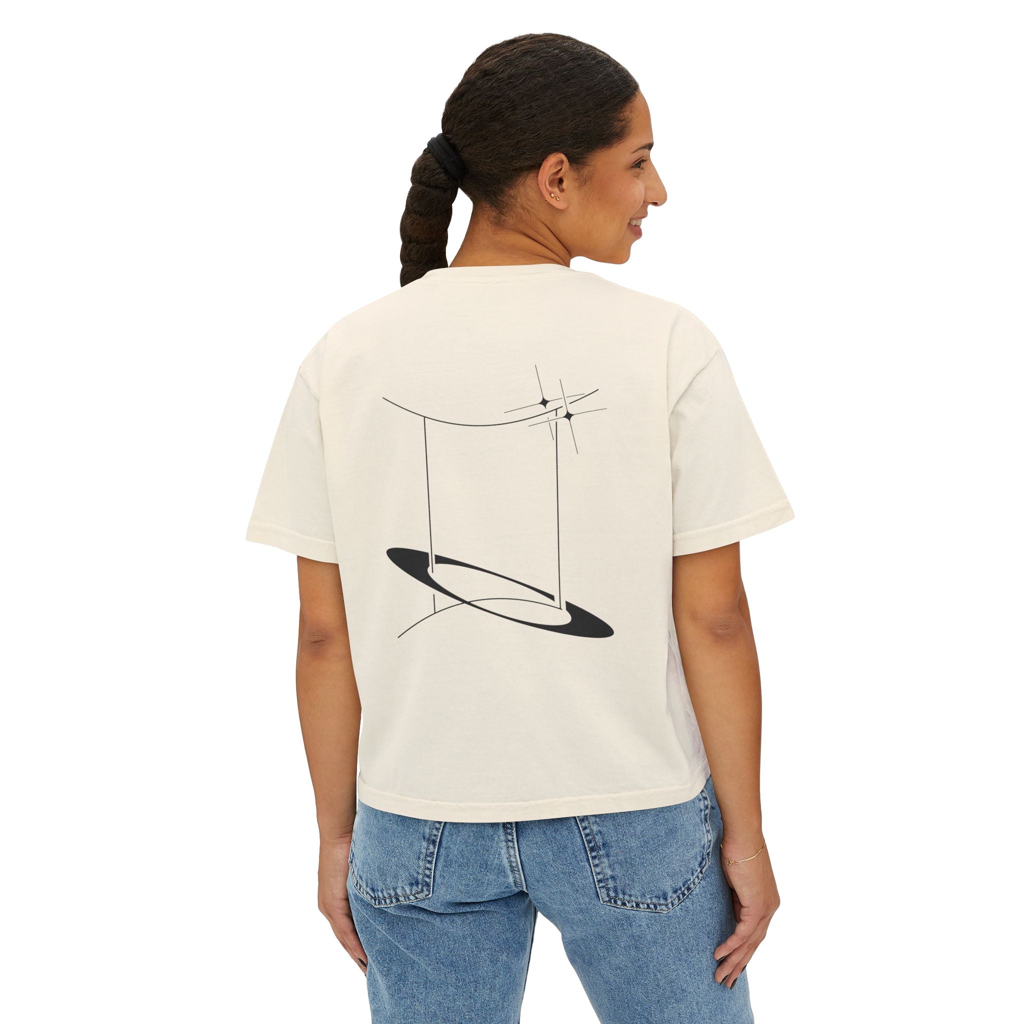 Person wearing a Beige t-shirt with a minimalist Gemini zodiac design in orbital line-art in the back