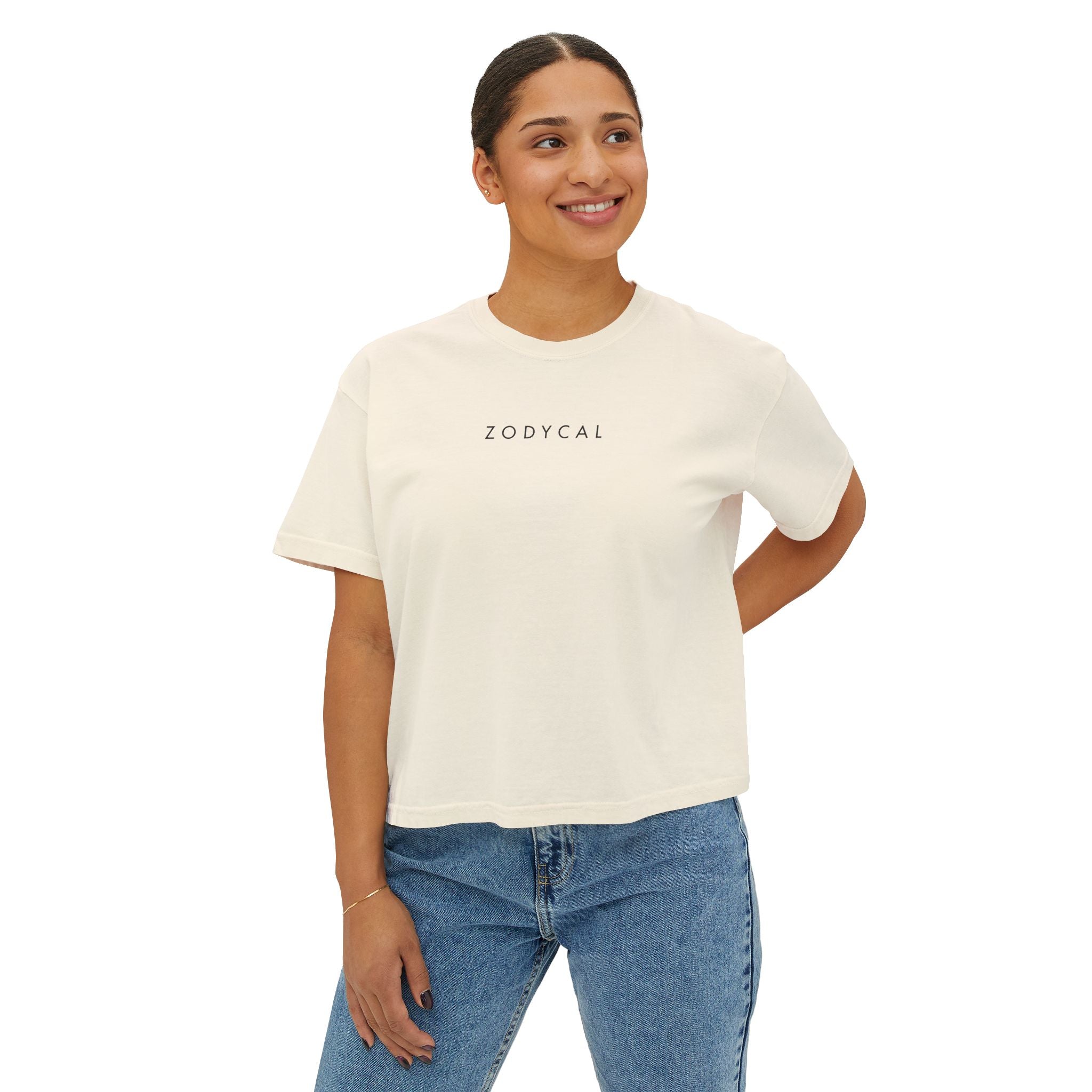 Woman wearing a Beige t-shirt with a minimalist Zodycal brand design