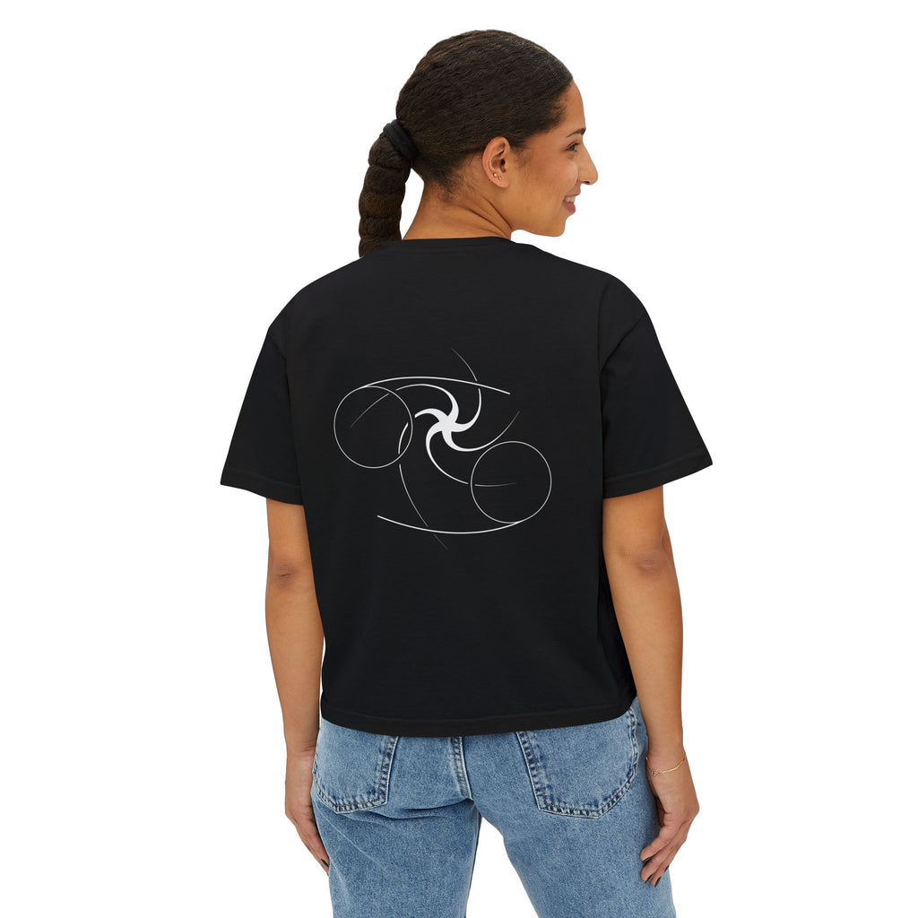 Person wearing a Black t-shirt with a minimalist Cancer zodiac design in orbital line-art in the back