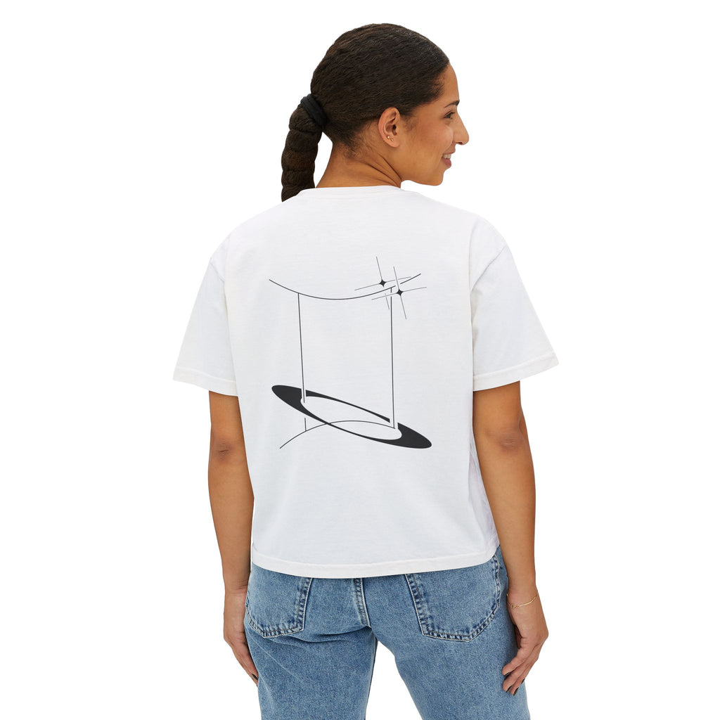 Person wearing a white t-shirt with a minimalist Gemini zodiac design in orbital line-art in the back